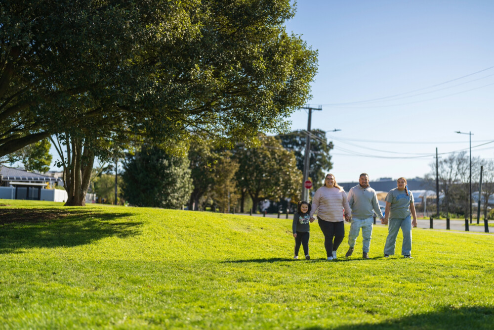 Family outside in a park walking 8895 HR