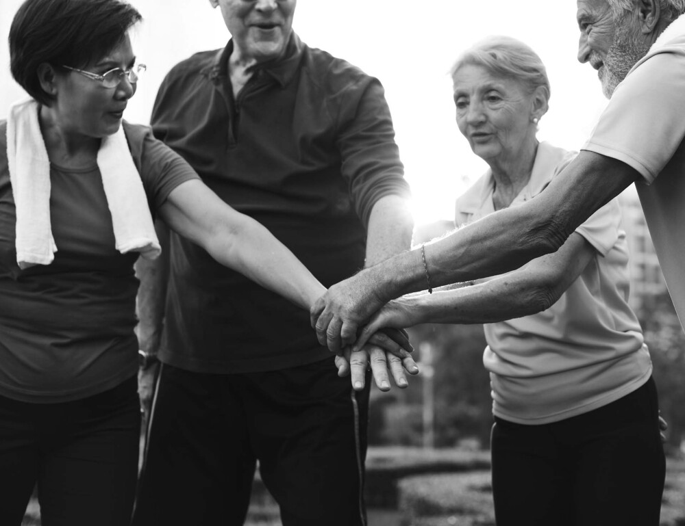 older people outside exercising black and white 2025